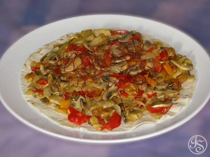 Champignongemüse auf Teigfladen